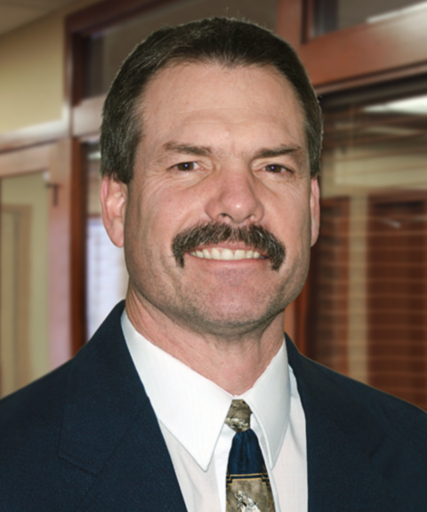 Headshot of Mark Bohrer wearing a suit and tie.