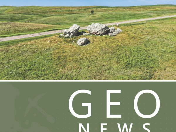 July 2025 Geo News cover features the Crown Butte Creek glacial erratic, one of North Dakota's largest. Location is west of Mandan in Morton County.