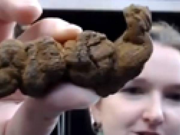 Becky holding fossil poo