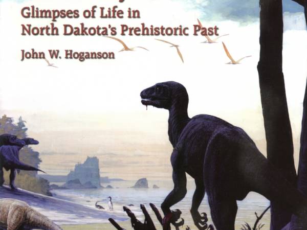Coastal scene with Dromaeosaur standing over a carcass