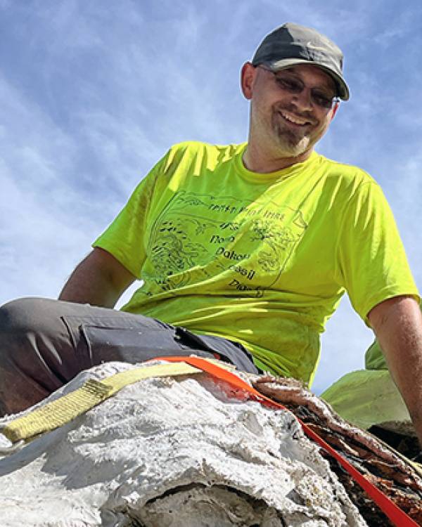 Clint Boyd wearing a bright yellow shirt.