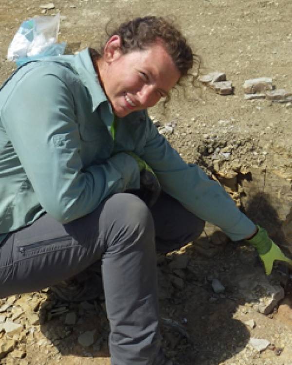 Alyssa Schiwal kneeling in the dirt