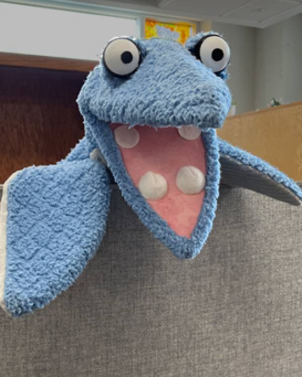 Blue dinosaur puppet