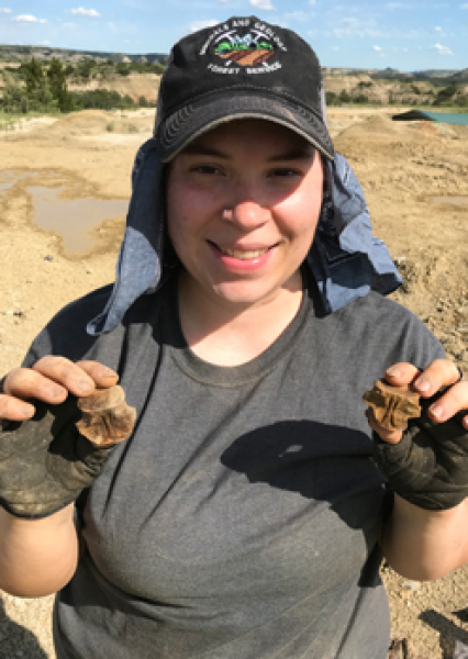 Alex holds champsosaur bones from the Medora site