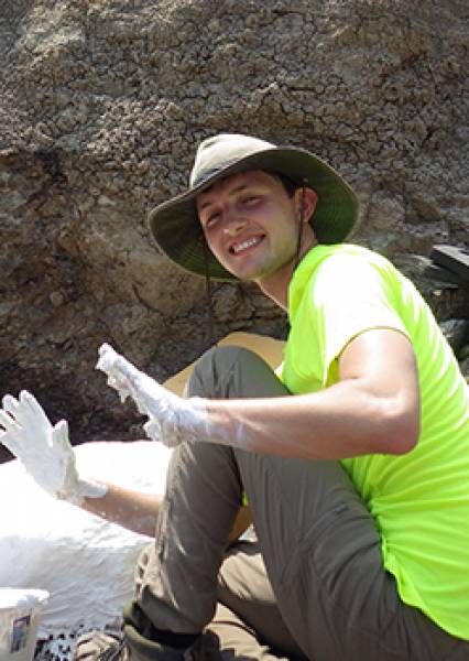 Kale sporting plaster covered hands