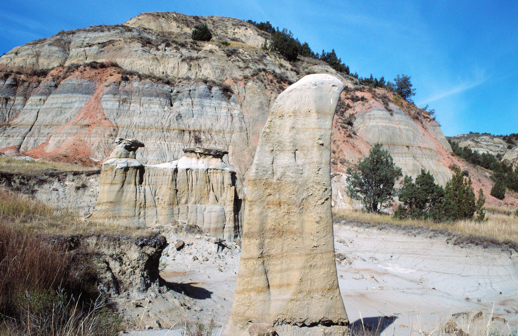 Photo of the Badlands with separate small, weathered formations.