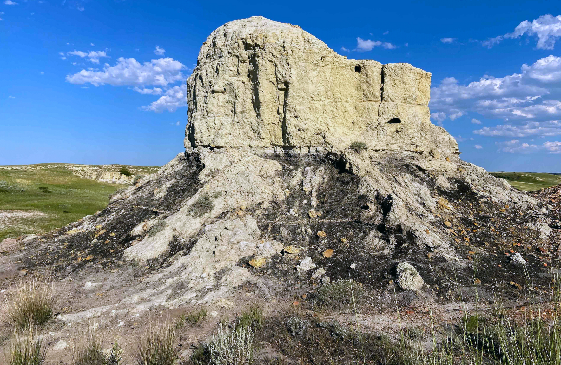 Rock formation photo against blue sky.