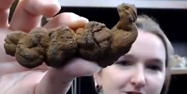 Becky holding fossil poo