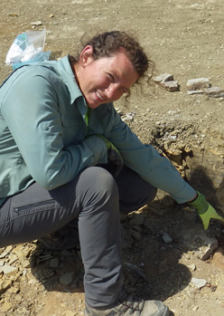 Alyssa pointing at fossil in situ