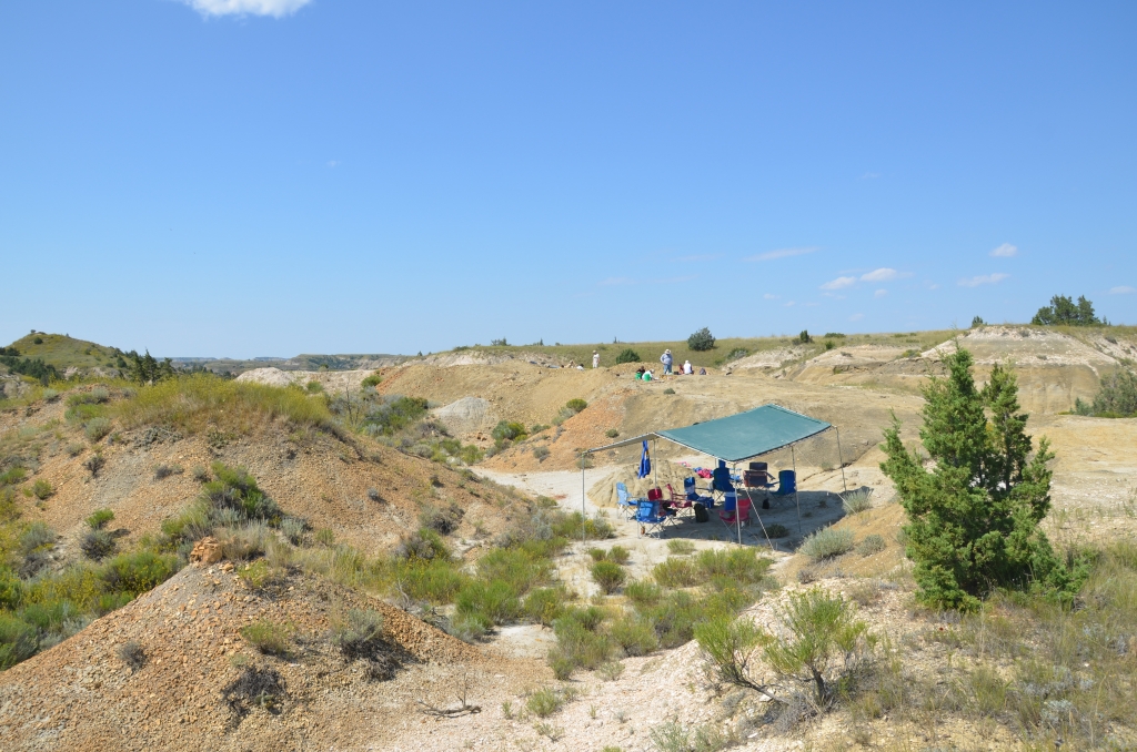 Diggers on the Medora site, with shade tent and chairs nearby