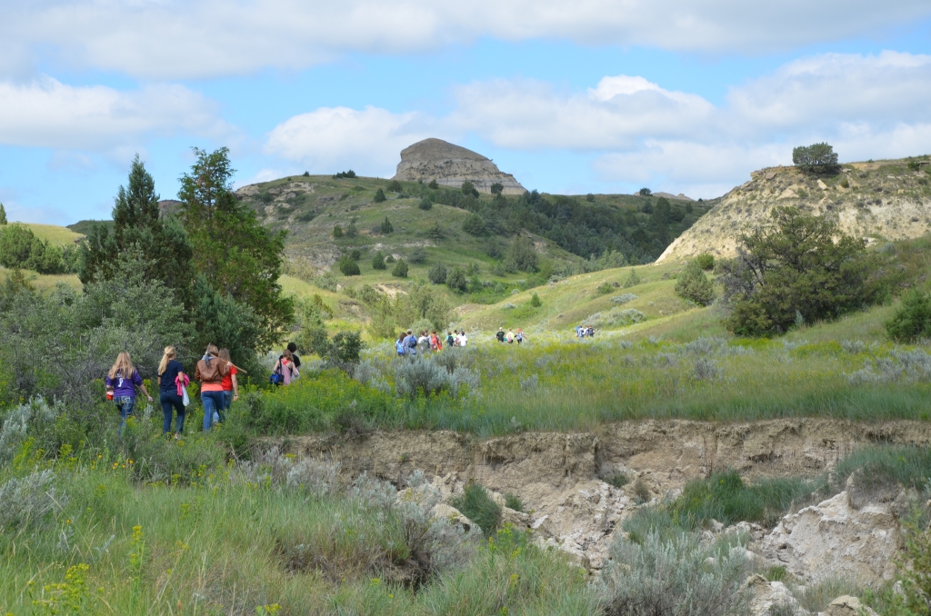 Diggers hiking out to the Whiskey Creek site