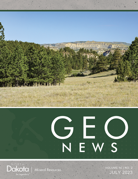 Geo News cover image featuring a photo of pine trees, buttes and blue sky.