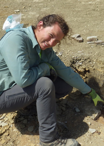 Alyssa pointing at fossil in situ