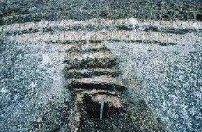 A fuller's earth deposit is exposed near the base of the Pierre Formation in the Pembina River Valley northwest of Walhalla in Cavalier County. 
								Fuller's earth is a fine earthy material that has the ability to bleach or absorb coloring matter from oils and fats. This deposit was discovered in the 1930s and was found to extend over portions 
								of eastern Cavalier and western Pembina counties. The deposit consists of a 4 to 8 foot bed of interbedded yellow bleaching clay and gray nonbleaching clay. This deposit was determined to contain a 
								bleaching value of 35 to 40%. 