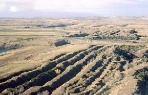 Aerial photograph of spoils northeast of Beulah. Prior to 1969, the state of North Dakota did not require reclamation of surface mines. As a result, approximately 6500 acres of spoil piles and surface cuts dot the countryside of western North Dakota. 