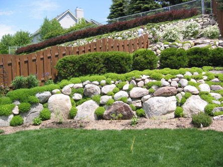 Landscaping in Bismarck, using glacial erratics and field stones.